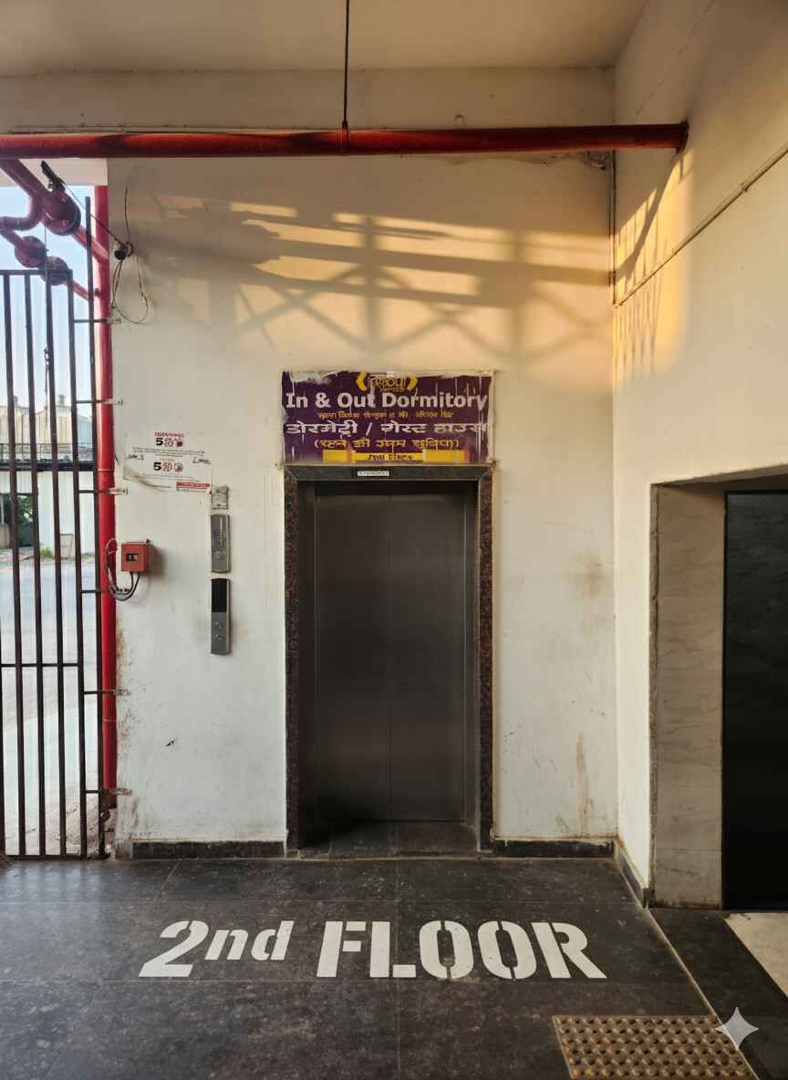 Lift area with In & Out Dormitory signage and 2nd floor marking