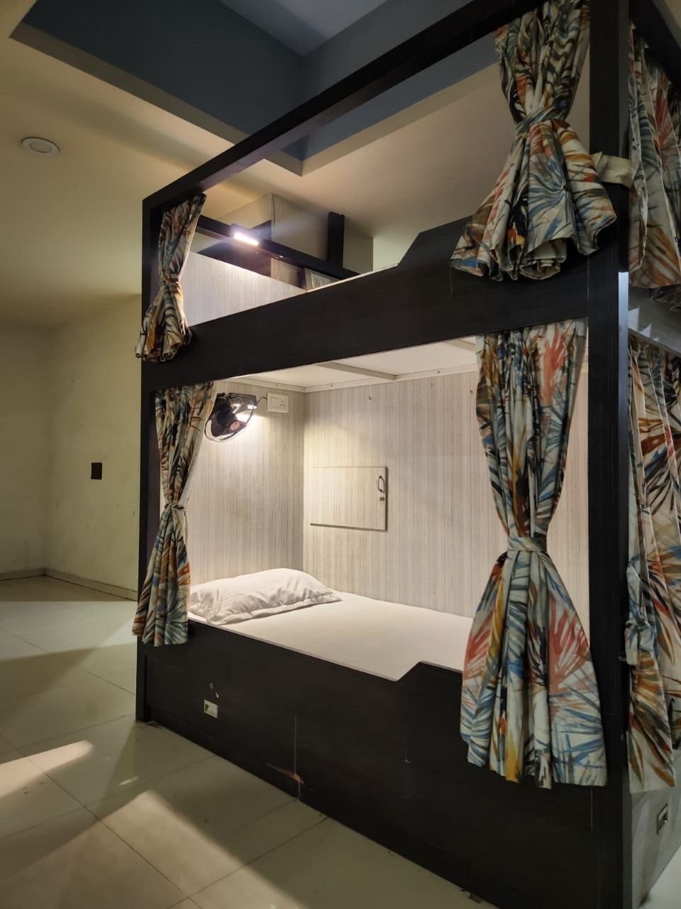 Bed cabin with open curtain showing interior